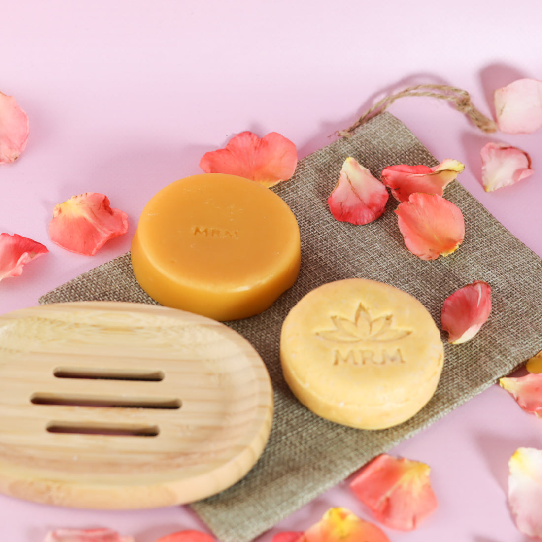 Oily shampoo &amp; Conditioner bar on bamboo dish