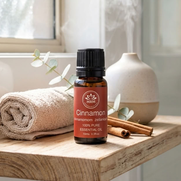 A bottle of Cinnamon 100% Pure Essential Oil by the brand &