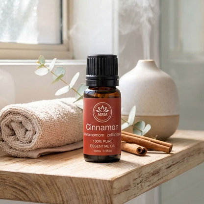 A bottle of Cinnamon 100% Pure Essential Oil by the brand &