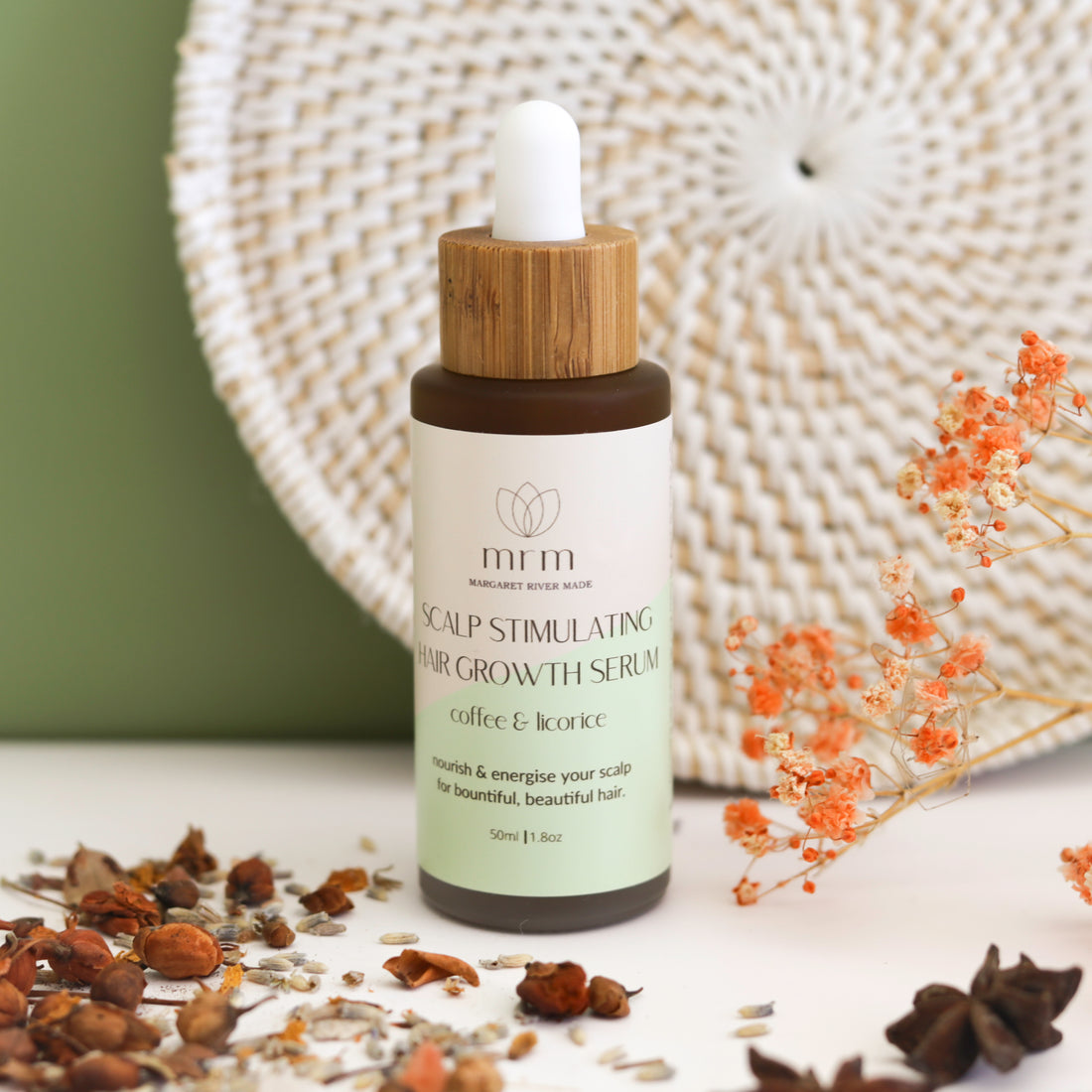 A bottle of our Scalp Stimulation Hair growth Serum for a healthy. scalp and healthy hair growth.