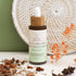 A bottle of our Scalp Stimulation Hair growth Serum for a healthy. scalp and healthy hair growth.